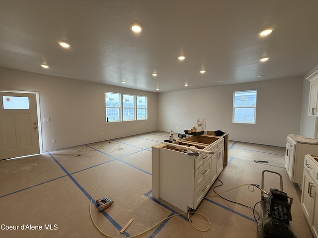 5147 E Norma Ave, Post Falls, ID 83854 - kitchen featuring recessed lighting, white cabinets, and plenty of natural light