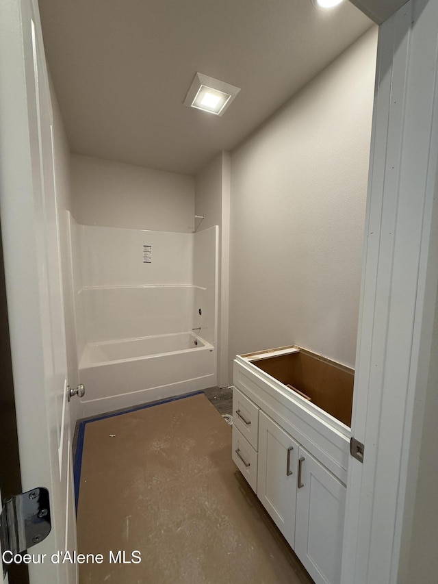 5147 E Norma Ave, Post Falls, ID 83854 - bathroom with vanity, bathtub / shower combination, and concrete flooring