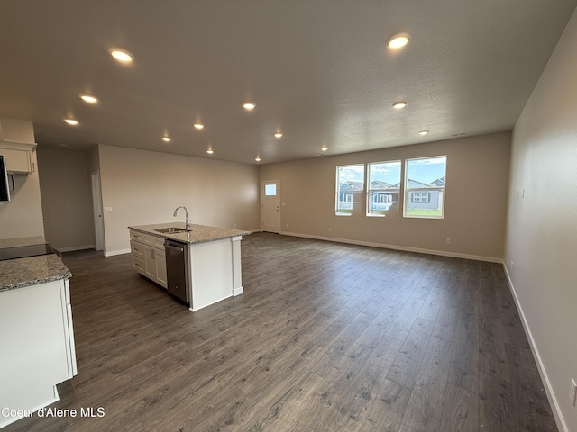 5147 E Norma Ave, Post Falls, ID 83854 - kitchen featuring stainless steel dishwasher, white cabinets, recessed lighting, dark wood-type flooring, and an island with sink
