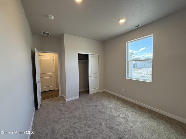 5147 E Norma Ave, Post Falls, ID 83854 - unfurnished bedroom featuring carpet flooring, a closet, and recessed lighting
