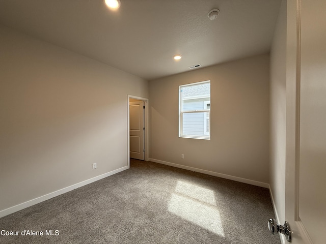 5147 E Norma Ave, Post Falls, ID 83854 - carpeted spare room featuring a smoke detector and recessed lighting