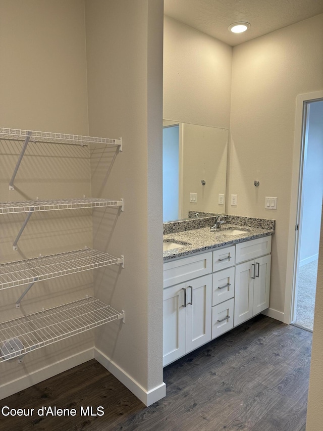 5147 E Norma Ave, Post Falls, ID 83854 - bathroom featuring wood finished floors and double vanity