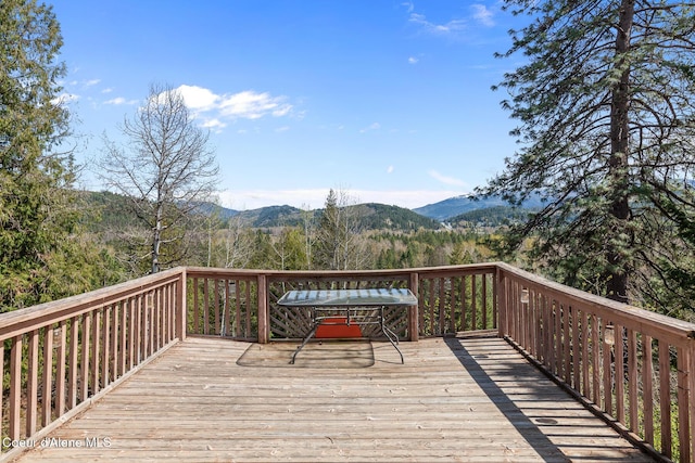 wooden deck featuring a mountain view