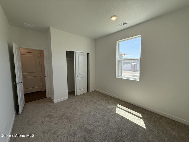 5119 E Rigel Ln, Post Falls, ID 83854 - unfurnished bedroom featuring carpet and a closet