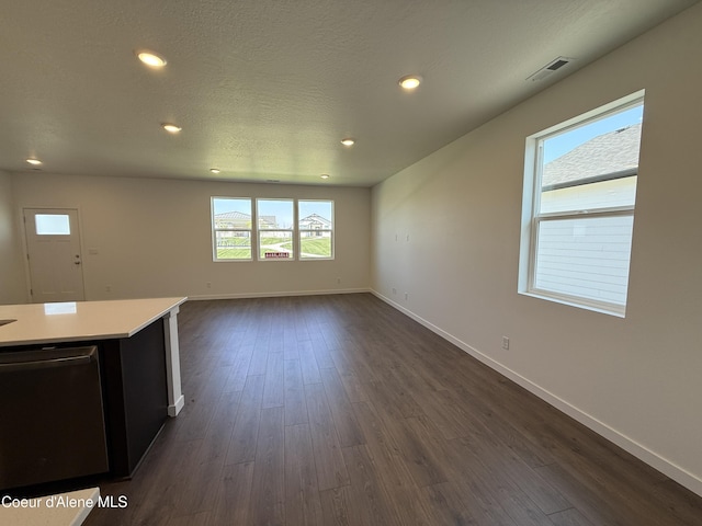 5119 E Rigel Ln, Post Falls, ID 83854 - unfurnished living room featuring dark wood-style flooring and recessed lighting