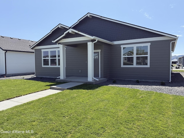 5119 E Rigel Ln, Post Falls, ID 83854 - view of front of property featuring a front yard and covered porch