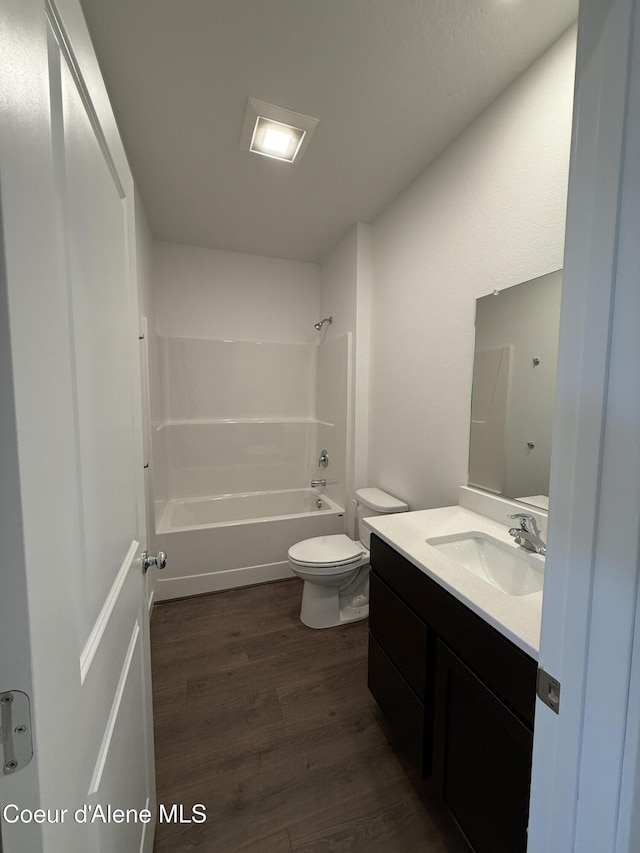 5119 E Rigel Ln, Post Falls, ID 83854 - full bathroom featuring vanity, wood finished floors, and shower / tub combination