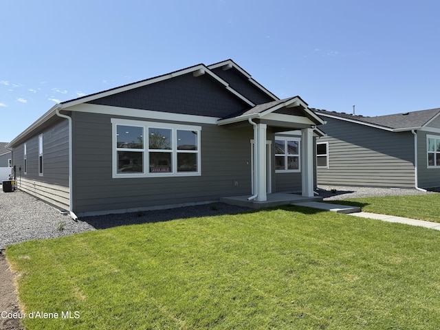 5119 E Rigel Ln, Post Falls, ID 83854 - view of front of house featuring a front yard