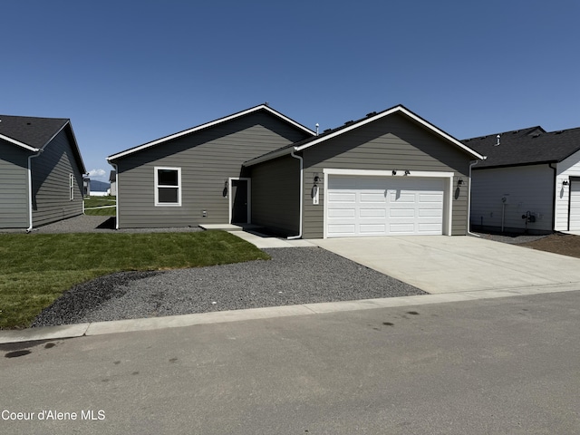 5119 E Rigel Ln, Post Falls, ID 83854 - ranch-style home with a garage, driveway, and a front lawn