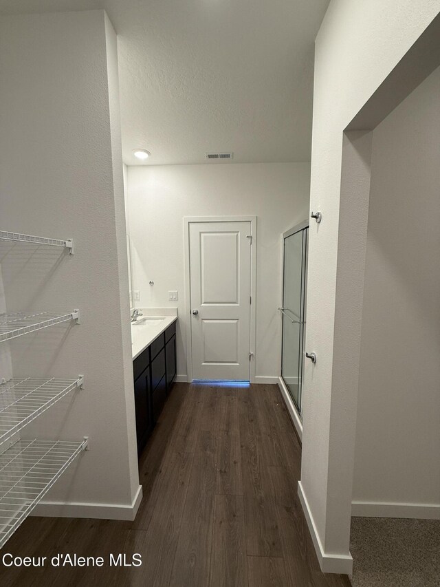 5119 E Rigel Ln, Post Falls, ID 83854 - full bath featuring wood finished floors, a stall shower, and vanity