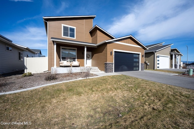 4302 N Donovan Ln, Post Falls, ID 83854 - contemporary house featuring covered porch, driveway, and an attached garage