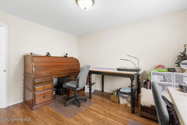 8514 W Grand Teton St, Rathdrum, ID 83858 - home office with baseboards and wood finished floors