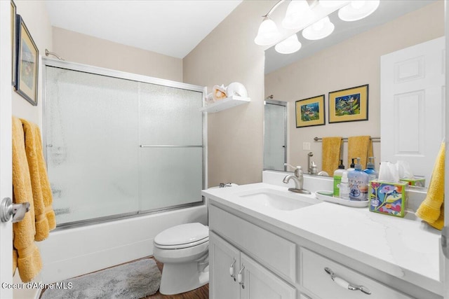 8514 W Grand Teton St, Rathdrum, ID 83858 - full bath with enclosed tub / shower combo, toilet, vanity, and wood finished floors
