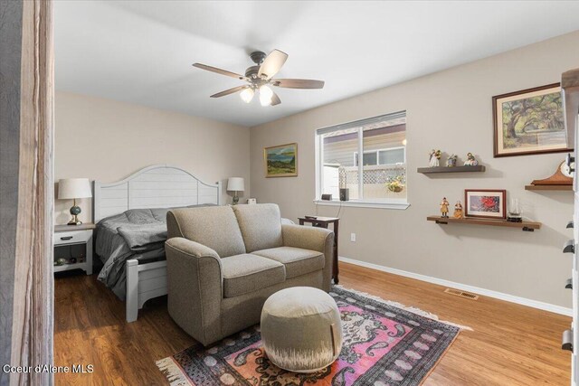 8514 W Grand Teton St, Rathdrum, ID 83858 - bedroom with wood finished floors, visible vents, baseboards, and ceiling fan