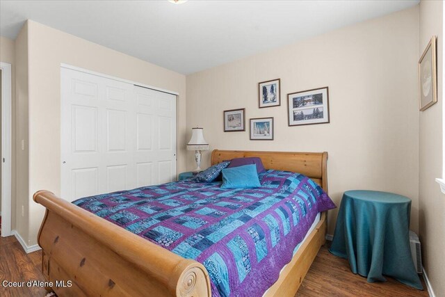 8514 W Grand Teton St, Rathdrum, ID 83858 - bedroom featuring baseboards, wood finished floors, and a closet