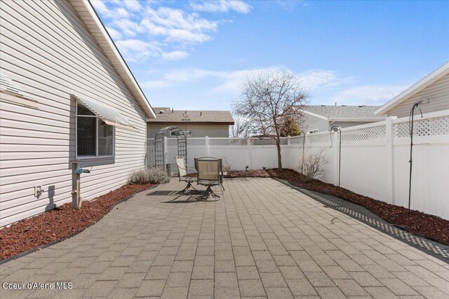 8514 W Grand Teton St, Rathdrum, ID 83858 - view of patio featuring a fenced backyard