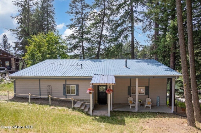 14314 N Waters Edge Ct, Hayden, ID 83835 - rear view of house featuring a metal roof