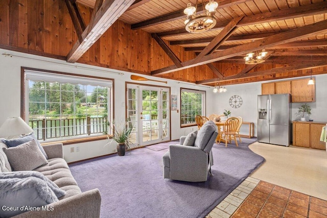14314 N Waters Edge Ct, Hayden, ID 83835 - living area featuring a chandelier, a wood ceiling with exposed beams, plenty of natural light, and high vaulted ceiling