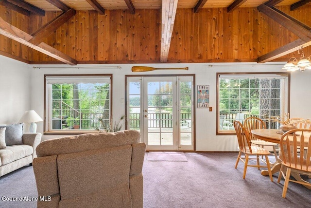 14314 N Waters Edge Ct, Hayden, ID 83835 - living area featuring wood ceiling, carpet floors, and wood walls