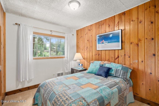 14314 N Waters Edge Ct, Hayden, ID 83835 - bedroom featuring carpet and wood walls
