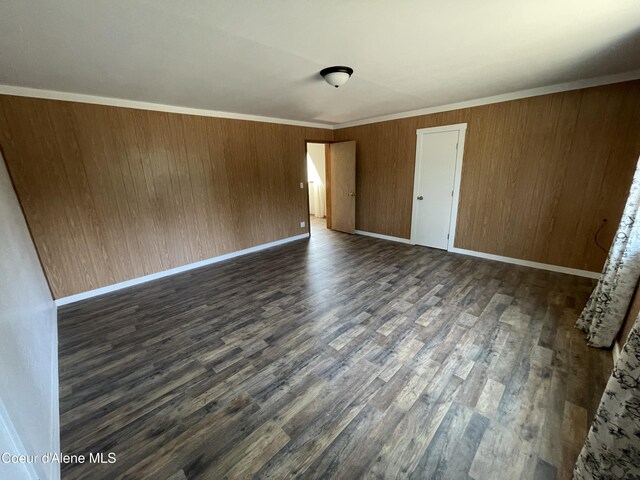 24731 N Wendler Loop, Rathdrum, ID 83858 - unfurnished bedroom featuring baseboards and dark wood-type flooring