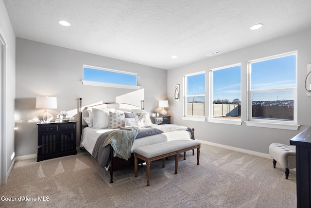 carpeted bedroom with baseboards, visible vents, and recessed lighting