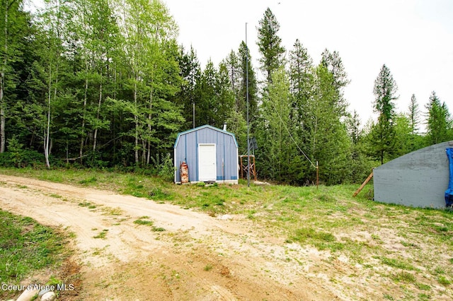 2884 Morris Rd, Naples, ID 83847 - view of yard with an outdoor structure and a storage shed
