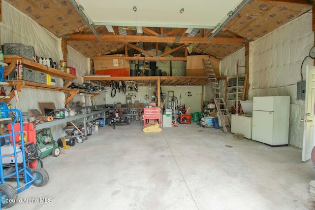2884 Morris Rd, Naples, ID 83847 - garage with electric panel and freestanding refrigerator