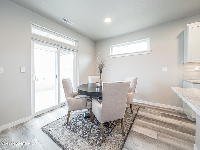 13748 N Apex Way, Hayden, ID 83835 - dining area with visible vents, light wood-style floors, recessed lighting, and baseboards