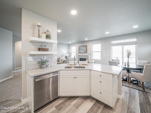 13748 N Apex Way, Hayden, ID 83835 - kitchen featuring open shelves, a sink, dishwasher, a fireplace, and a peninsula
