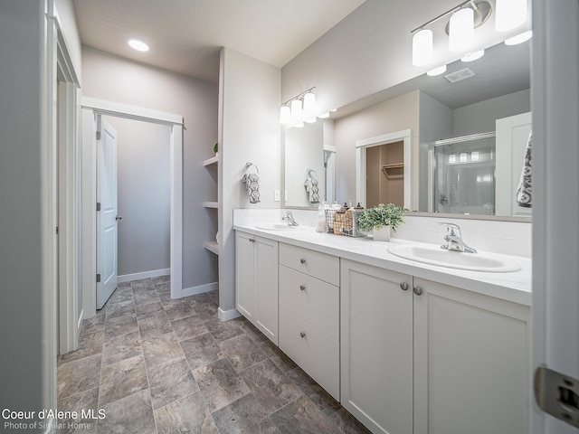 13748 N Apex Way, Hayden, ID 83835 - bathroom featuring baseboards, a sink, a shower stall, and visible vents