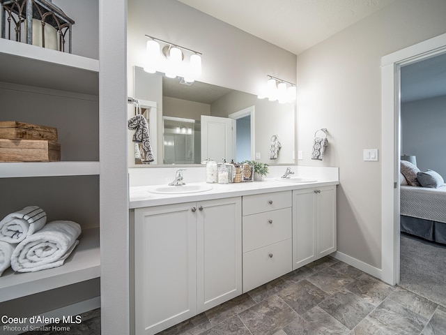 13748 N Apex Way, Hayden, ID 83835 - ensuite bathroom featuring stone finish flooring, double vanity, a sink, and ensuite bath