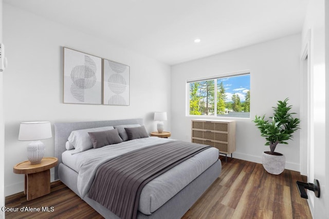 50 Carnelian Ave Unit 203, Ponderay, ID 83852 - bedroom with baseboards, recessed lighting, and wood finished floors