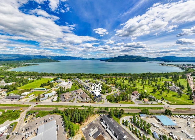 50 Carnelian Ave Unit 203, Ponderay, ID 83852 - drone / aerial view featuring a water and mountain view