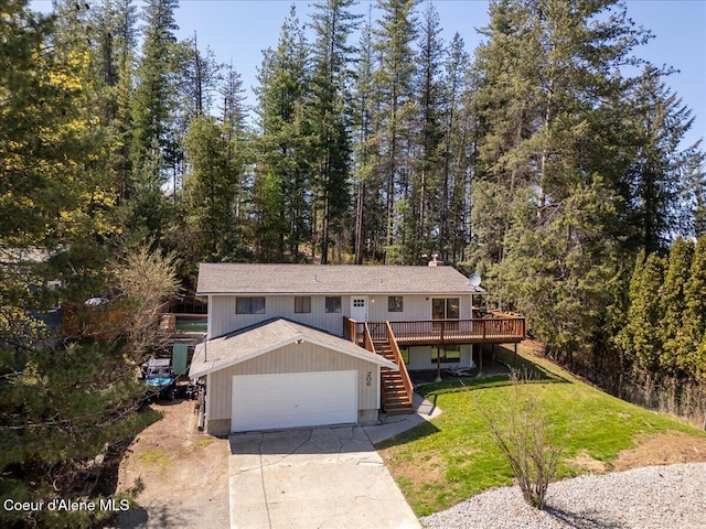 view of front of home with a chimney, a wooden deck, a front yard, concrete driveway, and stairs