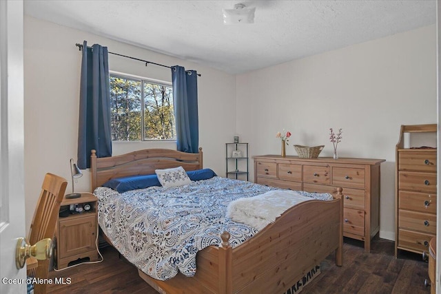 bedroom with dark wood finished floors