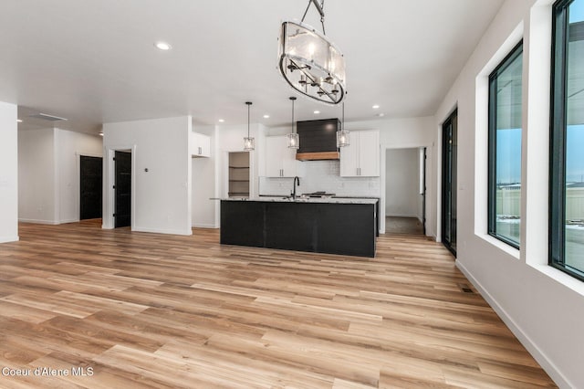 NNN Rocky Rd, Rathdrum, ID 83858 - kitchen featuring white cabinets, light wood finished floors, recessed lighting, and a sink