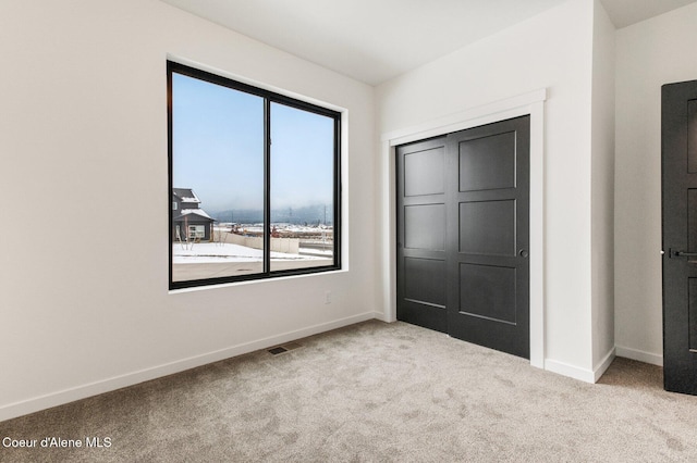 NNN Rocky Rd, Rathdrum, ID 83858 - unfurnished bedroom featuring carpet, visible vents, and baseboards