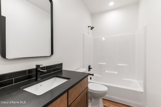NNN Rocky Rd, Rathdrum, ID 83858 - bathroom with recessed lighting, wood finished floors, toilet, vanity, and  shower combination