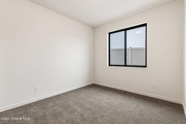 NNN Rocky Rd, Rathdrum, ID 83858 - carpeted spare room with baseboards