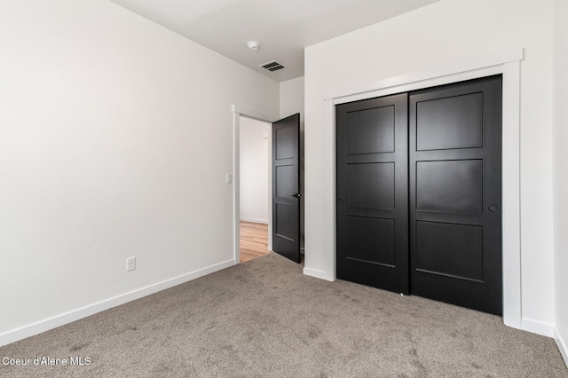 NNN Rocky Rd, Rathdrum, ID 83858 - unfurnished bedroom featuring a closet, visible vents, carpet flooring, and baseboards
