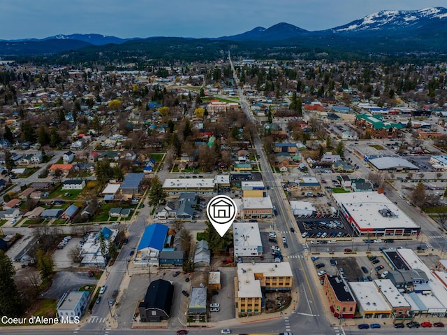 birds eye view of property with a mountain view