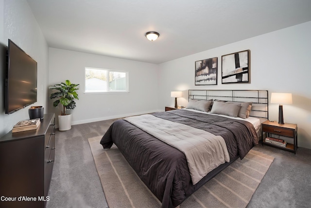 bedroom featuring carpet floors and baseboards