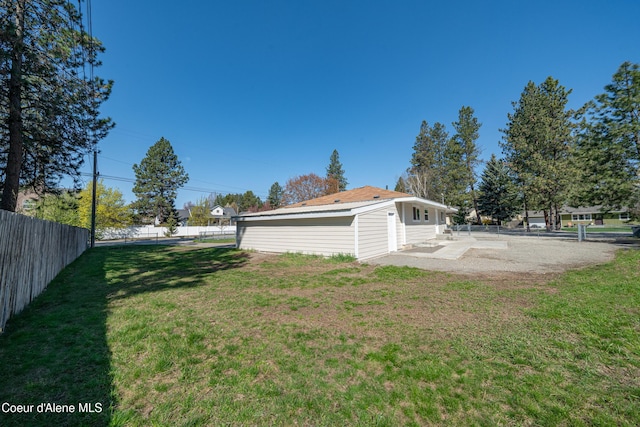 view of yard with a fenced backyard and a patio