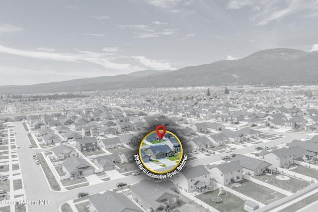 birds eye view of property featuring a residential view and a mountain view