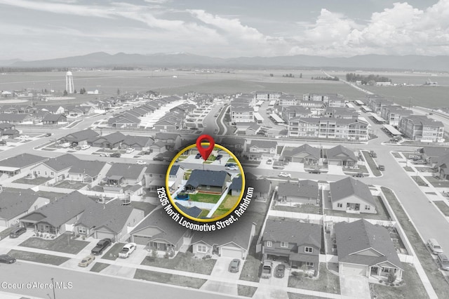 aerial view with a mountain view and a residential view