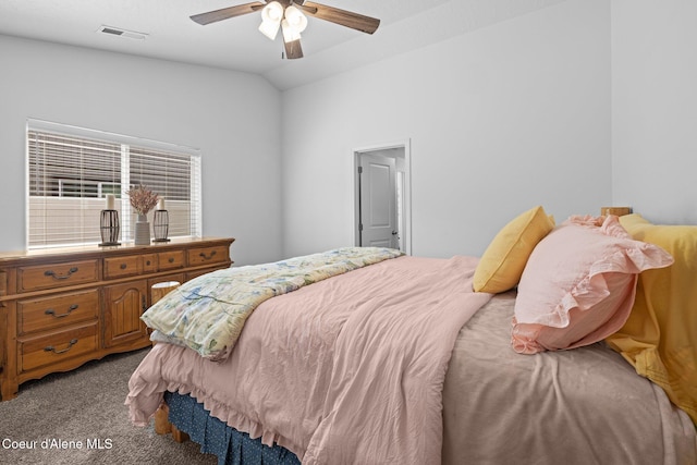bedroom featuring carpet floors, ceiling fan, visible vents, and vaulted ceiling
