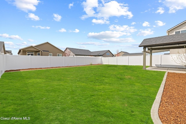 view of yard featuring a patio and a fenced backyard