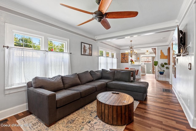 living room featuring visible vents, a healthy amount of sunlight, ceiling fan with notable chandelier, and wood finished floors
