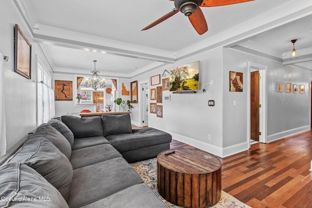 living room featuring baseboards, ornamental molding, ceiling fan with notable chandelier, and wood finished floors